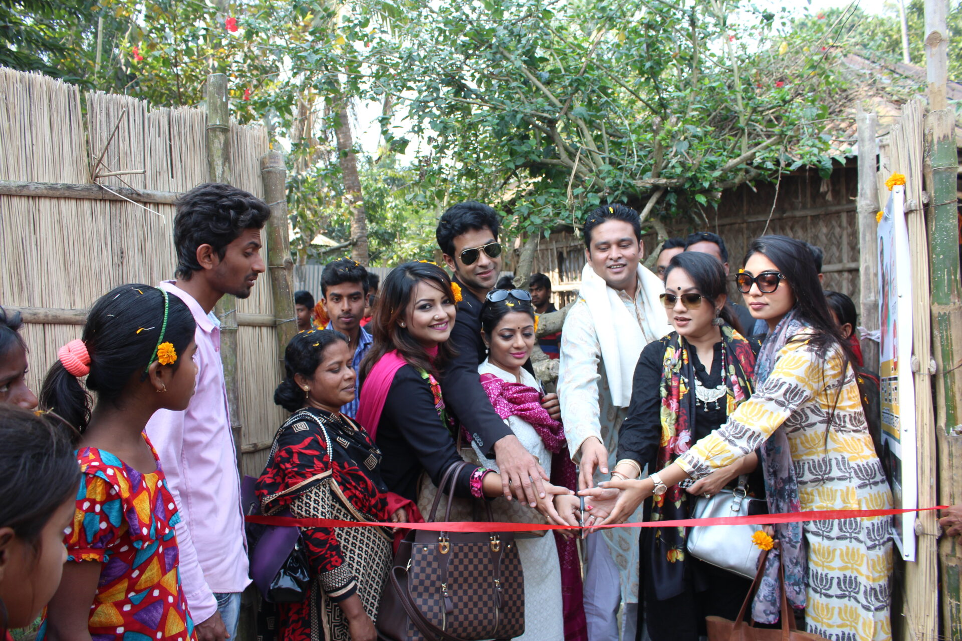 দেশের স্বনামধন্য শিল্পীরা একটিপ শেখ হাসিনা সেলাই কেন্দ্র উদ্বোধন করছেন | Renowned artists of the country inaugurating of the Sheikh Hasina Sewing Centres.